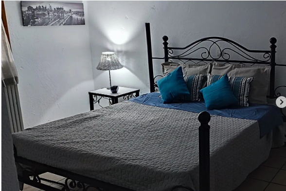 a bed with a bed and a lamp