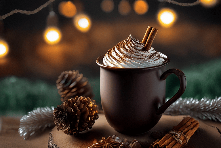 "Una taza de café con crema batida y canela."