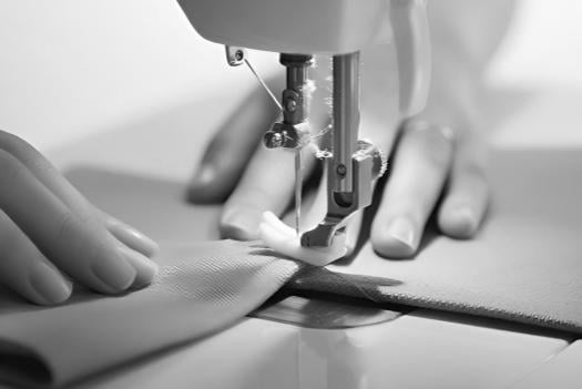 Close-up of precision sewing process at King Fly's manufacturing facility.