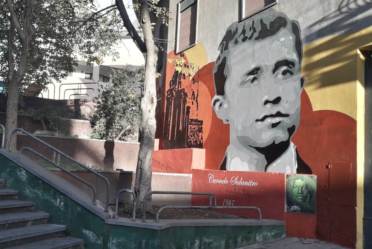 Mural dedicated to Carmelo Salanitro, created by Poliops on an urban wall, a historical commemorativ