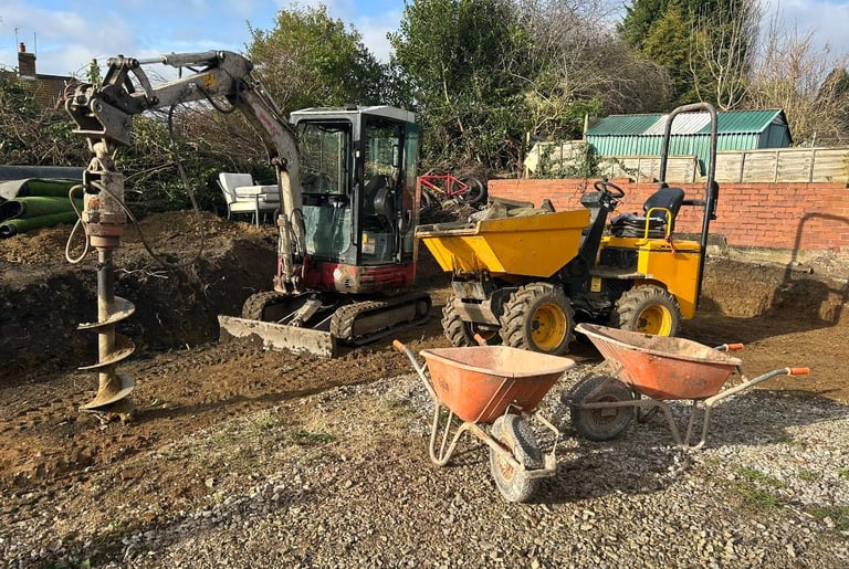Breaker tool removing old slab from commercial site in West Bromwich