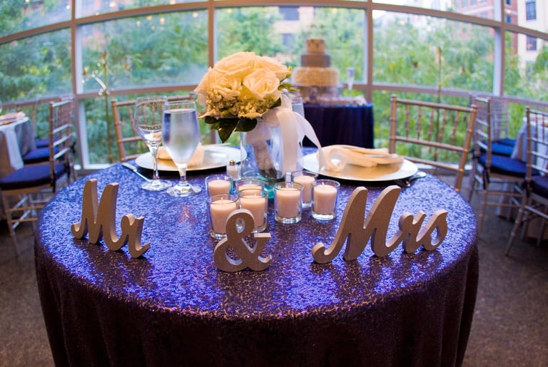 Bride and Groom center table with Mr and Mrs signs.. Wedding at Rockville Arts & Innovation Center,