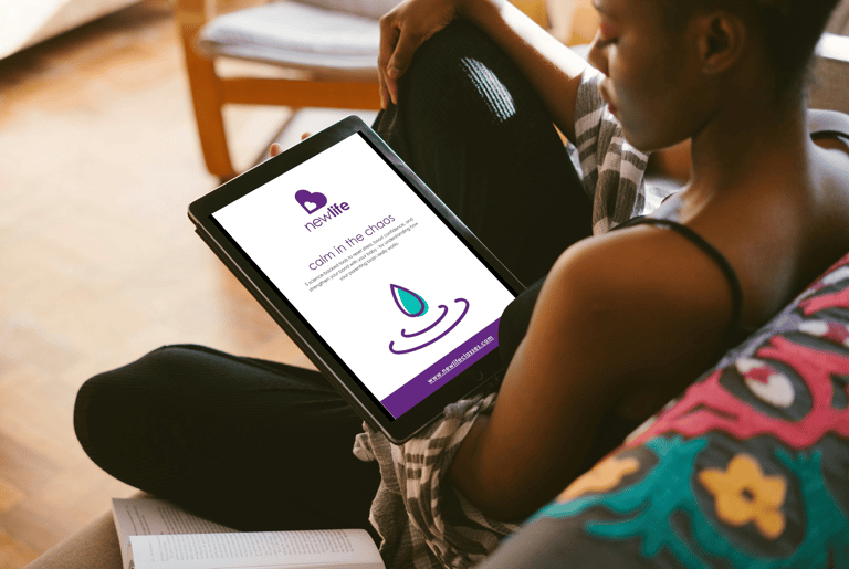 photo of woman on sofa reading 'calm in the chaos' guide on her tablet.