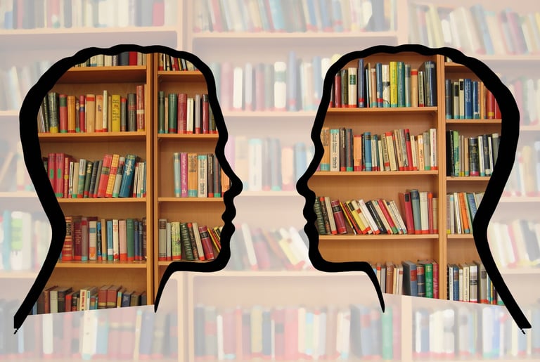 two people are facing each other in a library
