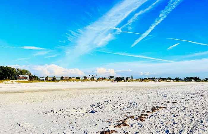 Scenic beaches with soft white sand and clear blue water on Anna Maria Island, Florida.