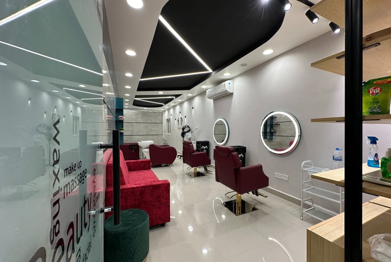 a salon with a red couch and a mirror