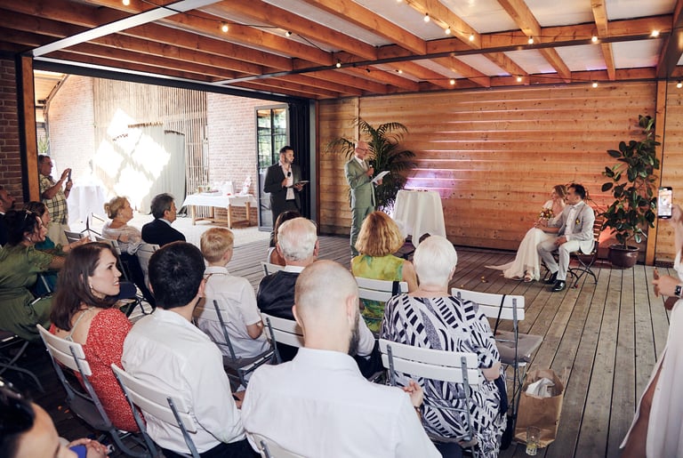 Father of the bride speaking during a ceremony.