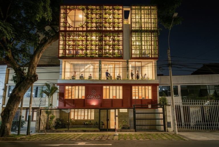Modern office building at night featuring a vertical green wall and glass facade architecture.