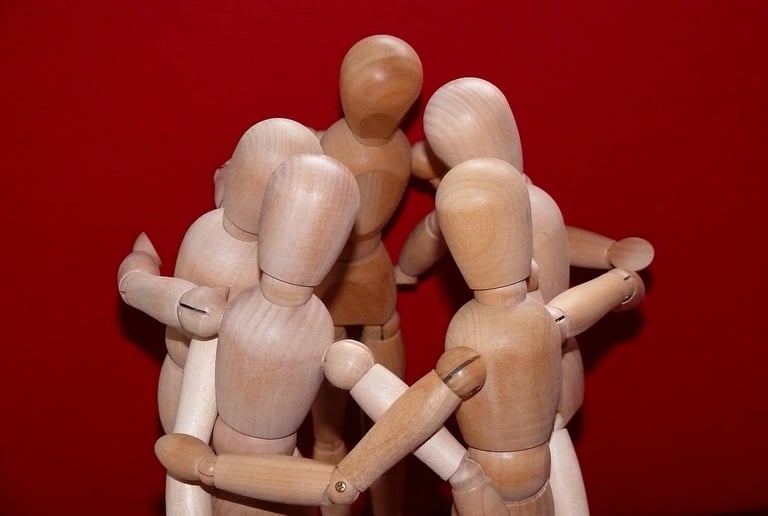 wooden figures in a collectivist cluster