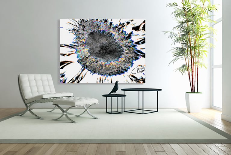 Canvas wall print on wall with an abstract sunflower on it and furniture in roomand furn 