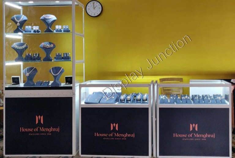 a display case with a clock and jewelryExhibition by Bhima Jewellers Kerla using our Portable Showca
