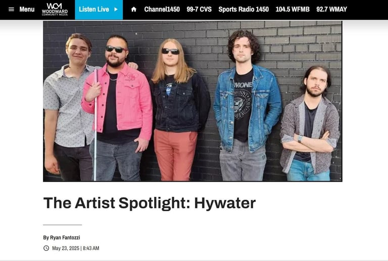 A website screen shot featuring members of Hywater standing in front of a brick wall