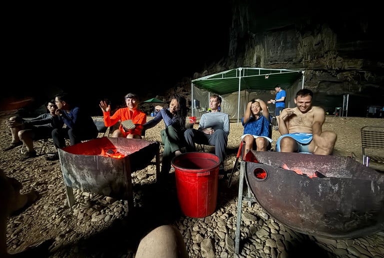 Chilling by the camp fire in Hang En cave, ke bang national park Vietnam