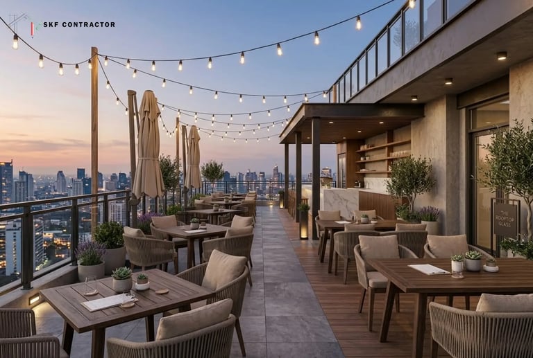 Modern luxury rooftop terrace bar with outdoor seating and string lights overlooking a city skyline at sunset.