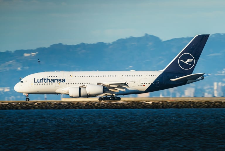 A Lufthansa aircraft parked near a body of water