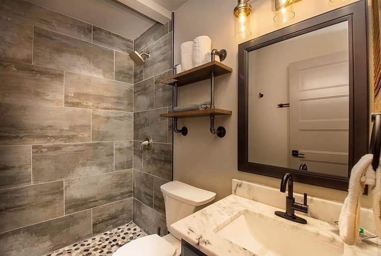 Full bathroom renovation in Fraser, CO featuring walk-in tile shower and custom vanity.