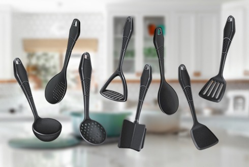 a kitchen counter top with a variety of utensils