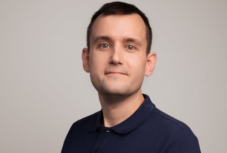 a man in a blue shirt and a white shirt