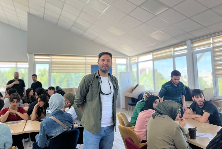 a man standing in a room with a bunch of people