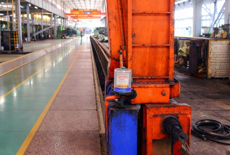 Single point automatic lubricator applied on crane bearing in industrial workshop