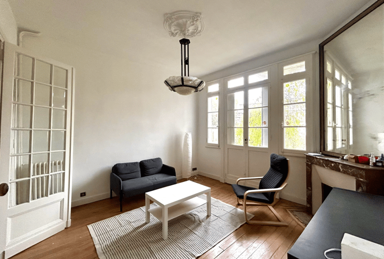 a living room with a couch and a table