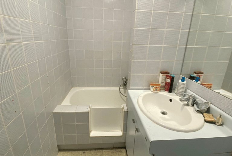 a bathroom with a sink and a tub in it