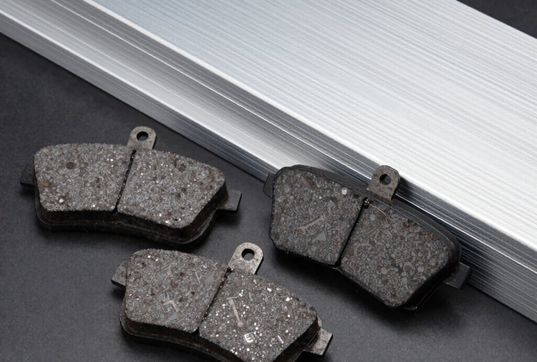 Close-up of stacked colorful technical plastic sheets in an industrial warehouse