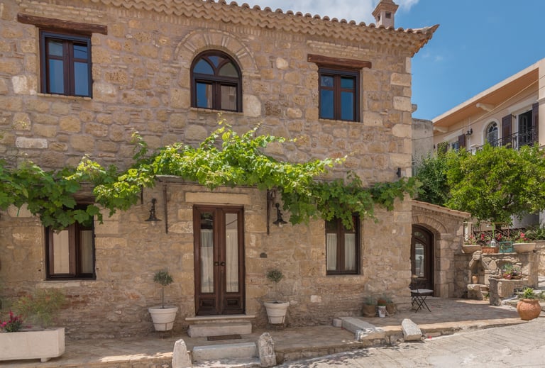 Authentic 1900s stone exterior of Villa Galanoussa in Zante Town, showcasing traditional Zakynthian architecture.