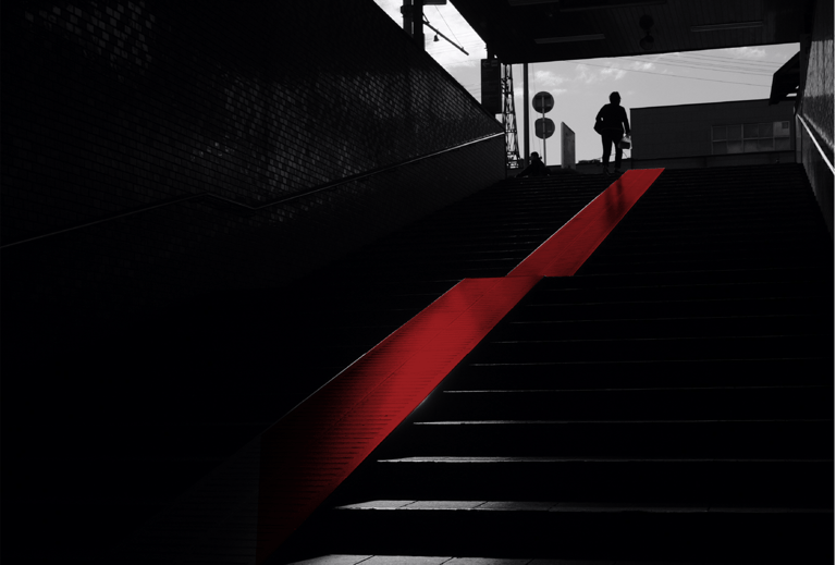 a person walking up stairs in a dark room