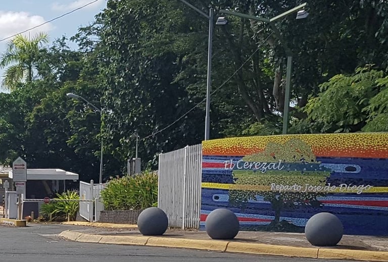 a bus stop sign on a street corner