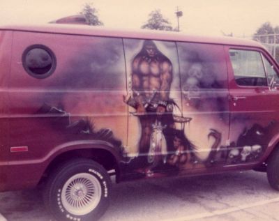 a van with a painting of a man on it