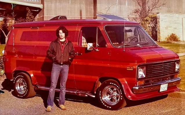 a man standing next to a van