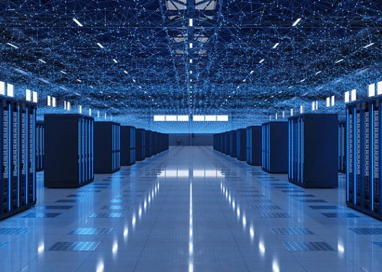 Blue-lit data center with rows of server racks, illustrating secure cloud infrastructure and scalabl