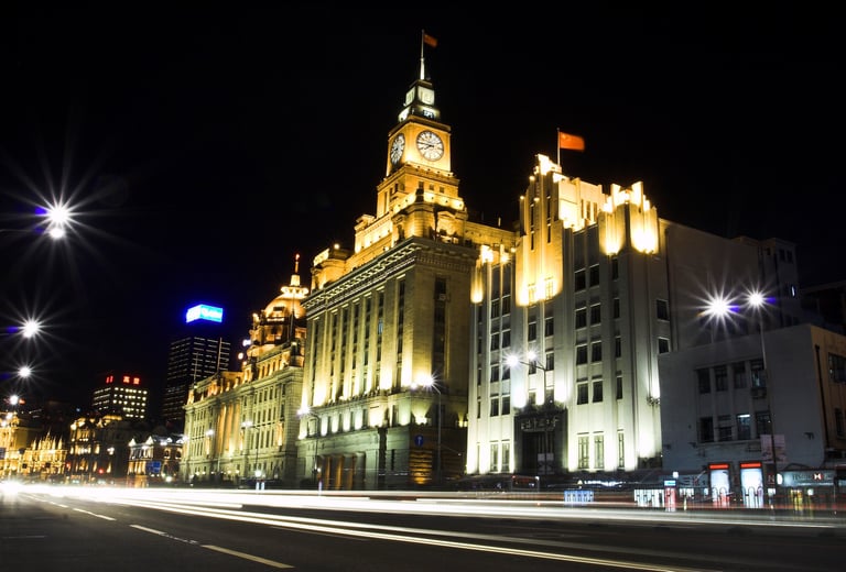 Cityscape of Shanghai Bund by Night with headlight trails