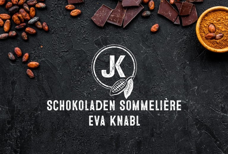 Schokoladen Sommelière Eva Knabl logo on dark stone background with cocoa beans and dark chocolate pieces.