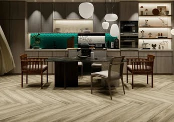 Modern kitchen with herringbone wood flooring, dining table, and teal backsplash tile.