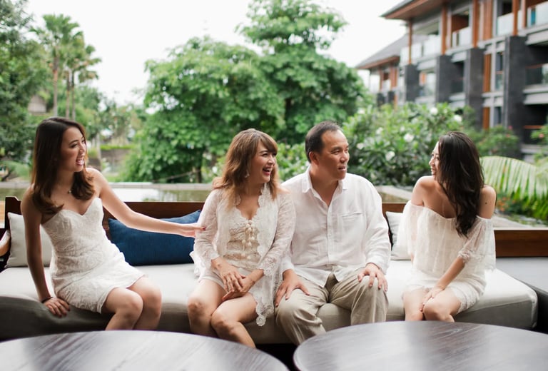 Janice family sharing a relaxed moment during a lifestyle photography session at Indigo Seminyak Bali