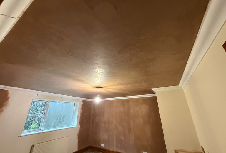 Artex removed and ceiling plastered leaving a lovely smooth surface ready for redecoration.