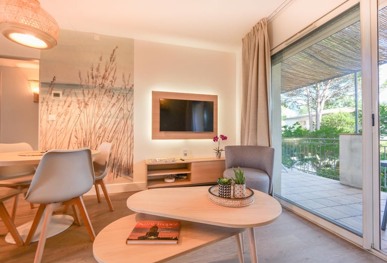 a living room with a table and chairs