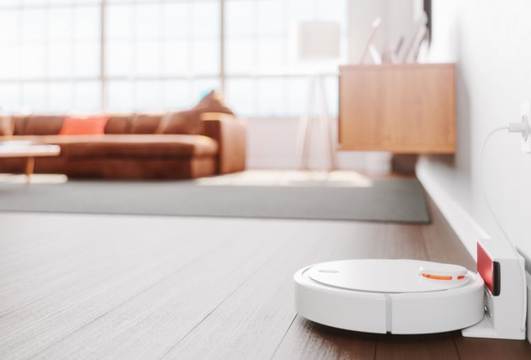 a robot vacuum cleaner is on the floor