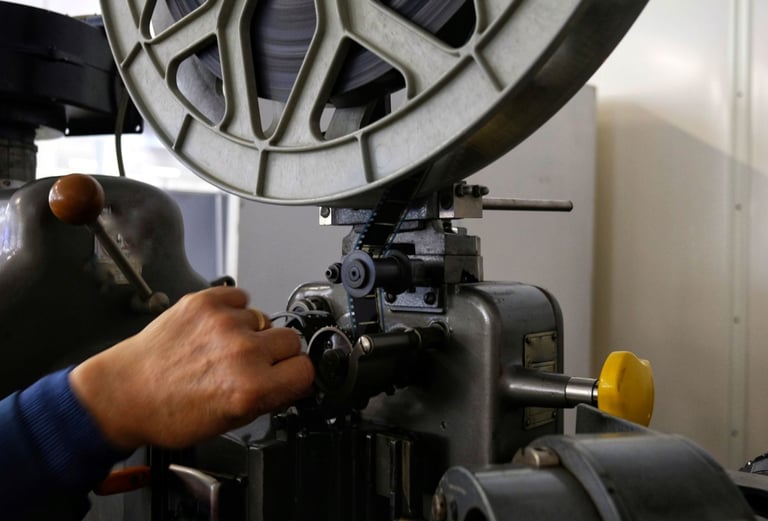 a man working on a machine in a factory