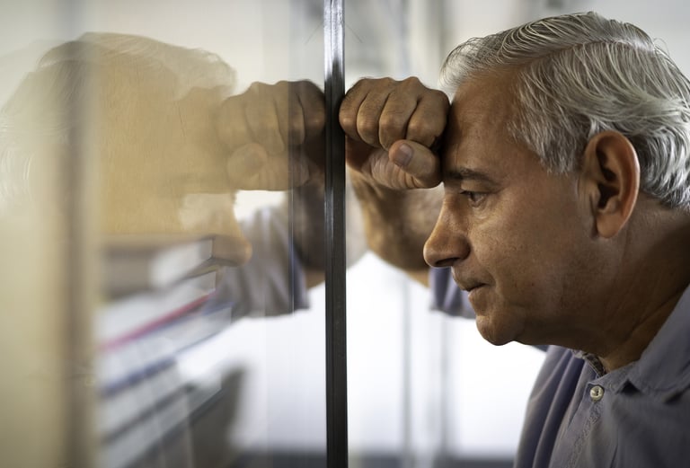 a man in a blue shirt is looking at something