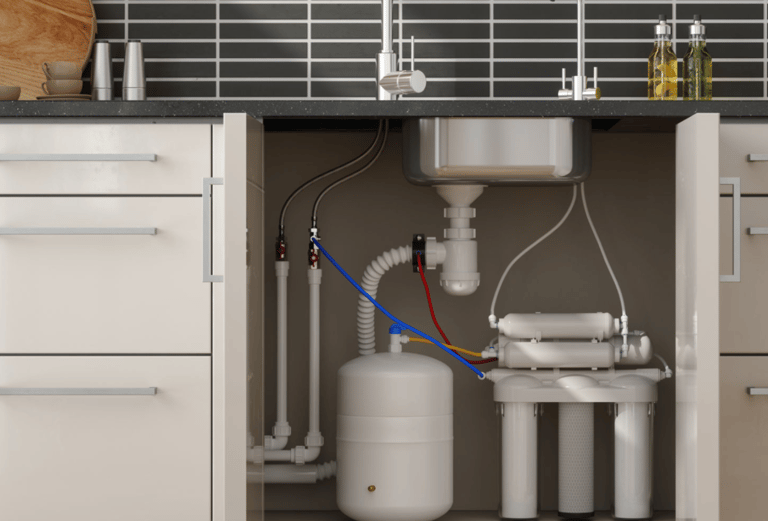 a kitchen sink with a water tank and a hose