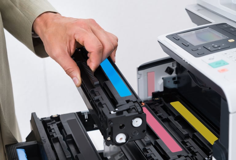 a man in a suit is holding a printer