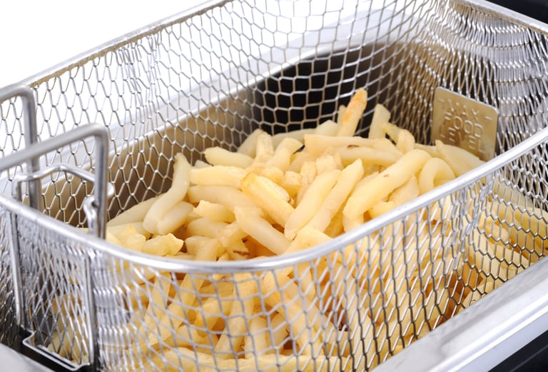 a basket of fries with fries on top of it