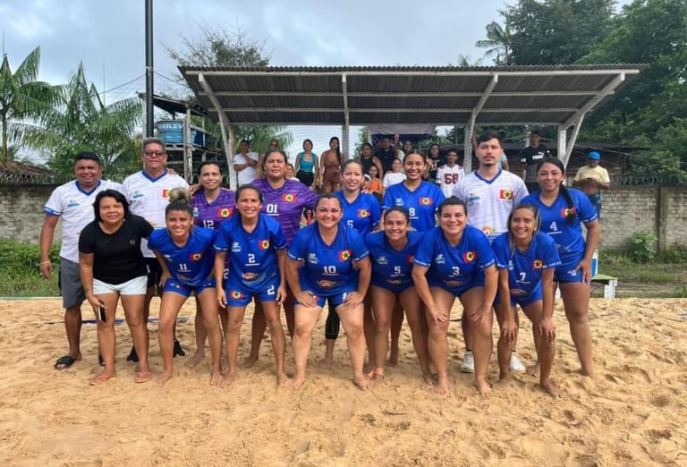 a group of people standing around a beach