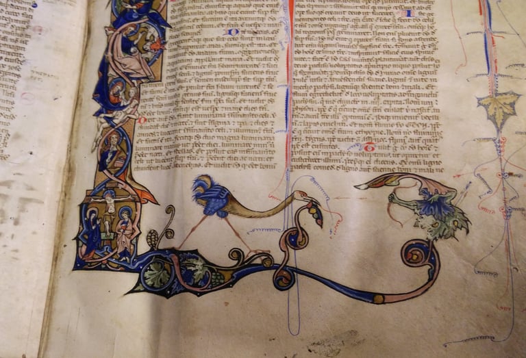 A lavishly decorated page of a bible, 13th Century, Italy.