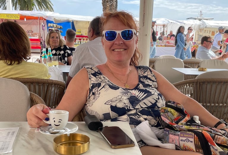 Picture of Teva in Split, Croatia, relaxing with a cup of espresso waiting for clients