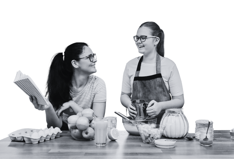 Two young people cooking in the kitchen