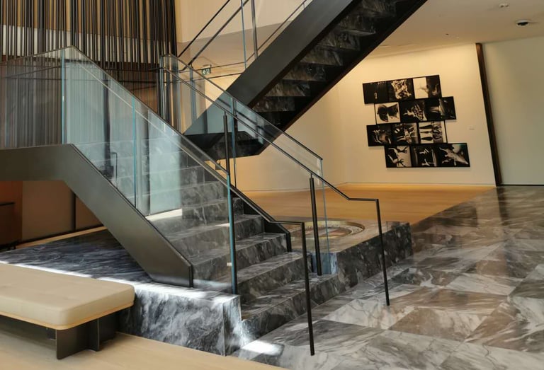 Second angle of Scotiabank North marble feature stairs, by by Pengelly Iron Works